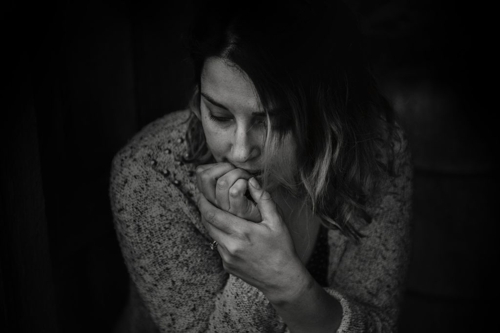 A woman looking worried and anxious